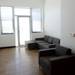 A flat screen television, modern couch and wood floors are some of the features in this unit at Landmark. Melanie Maxwell I AnnArbor.com